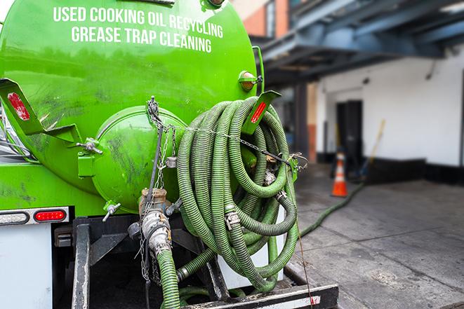 a pump truck emptying a grease trap in Alpaugh CA